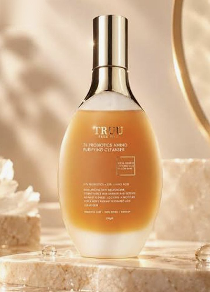 TRUU 76 Probiotics Amino Purifying Cleanser on a marble plinth in warm light